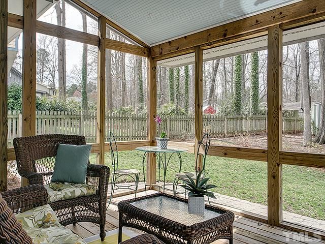 609 Ortega Road Raleigh, NC 27609 - Photo 3 of 25 a living room with furniture and a floor to ceiling window