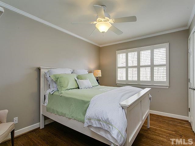 609 Ortega Road Raleigh, NC 27609 - Photo 21 of 25 a bedroom with a bed and a window