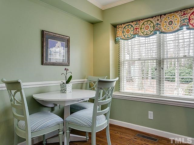 609 Ortega Road Raleigh, NC 27609 - Photo 9 of 25 a view of a dining room with furniture and a window