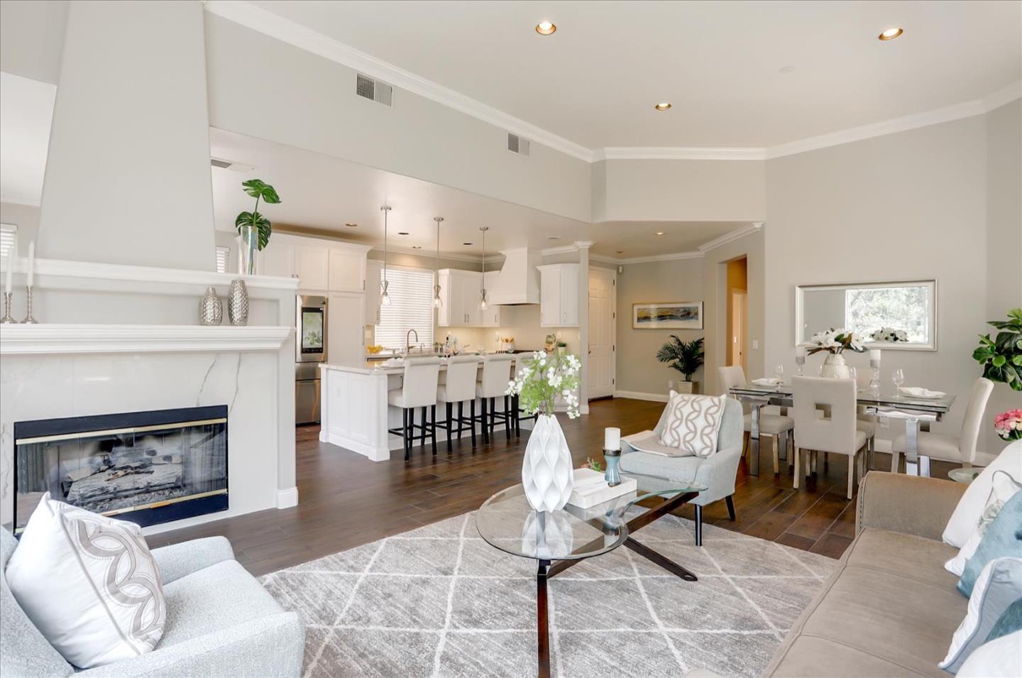 5889 Killarney Circle San Jose, CA 95138 - Photo 12 of 68 a living room with furniture a fireplace and a table