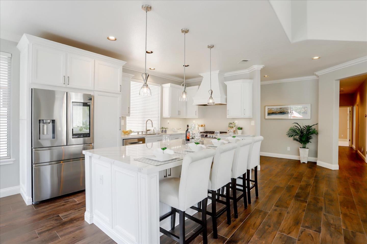 5889 Killarney Circle San Jose, CA 95138 - Photo 13 of 68 a kitchen with stainless steel appliances kitchen island a refrigerator and a stove