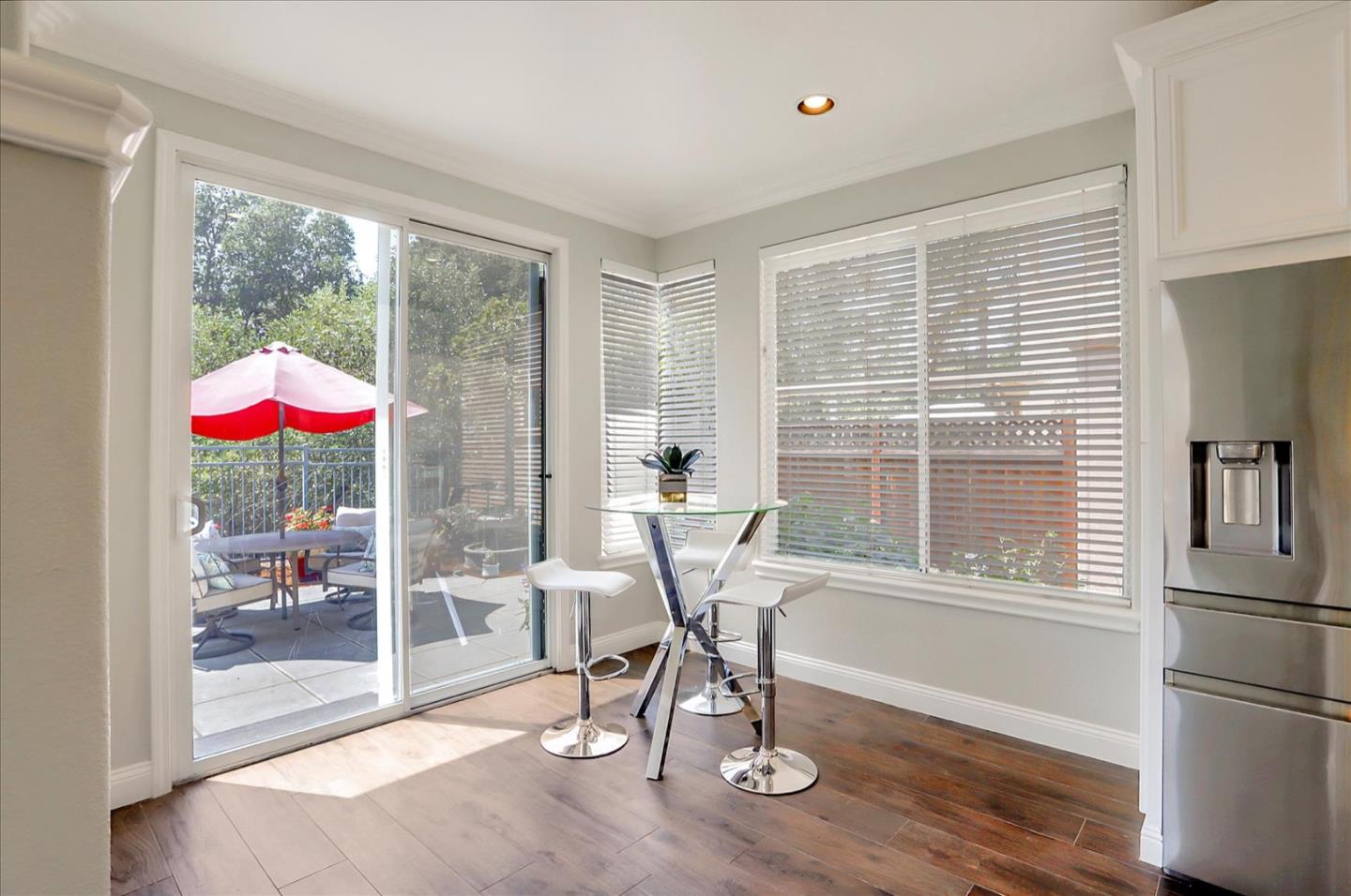 5889 Killarney Circle San Jose, CA 95138 - Photo 19 of 68 a work room with wooden floor and a table