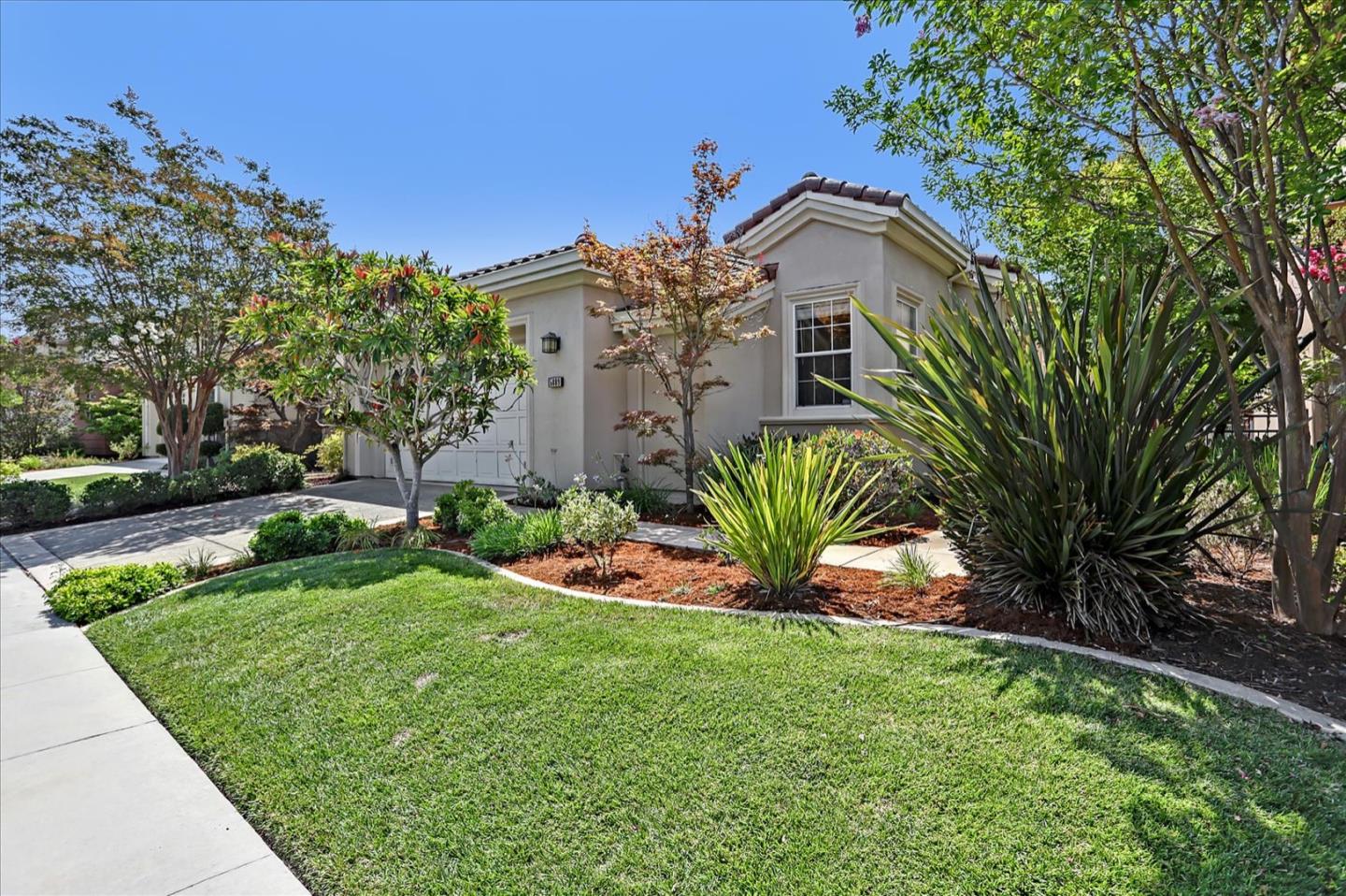 5889 Killarney Circle San Jose, CA 95138 - Photo 3 of 68 a front view of a house with a garden