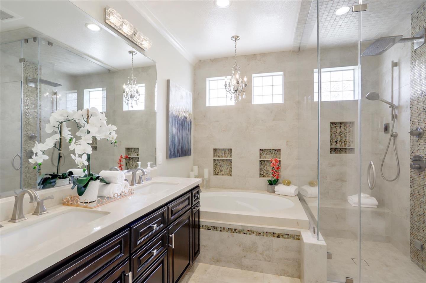 5889 Killarney Circle San Jose, CA 95138 - Photo 35 of 68 a spacious bathroom with a granite countertop tub sink a mirror a vanity and shower