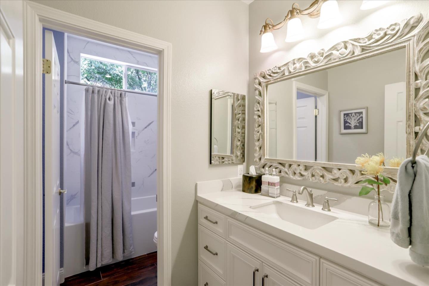 5889 Killarney Circle San Jose, CA 95138 - Photo 36 of 68 a bathroom with a double vanity sink and a mirror