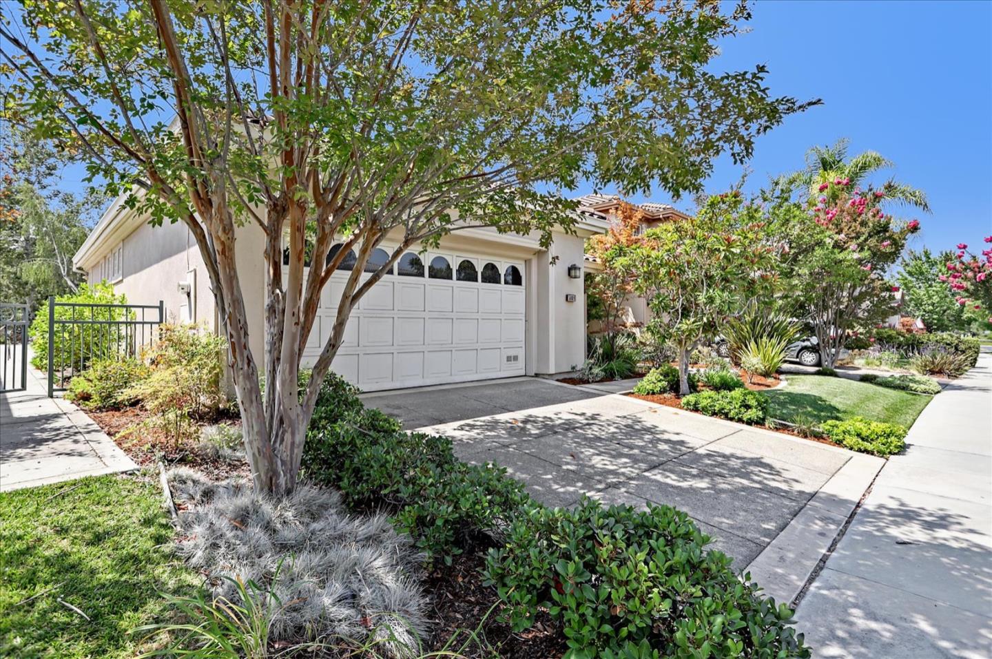 5889 Killarney Circle San Jose, CA 95138 - Photo 4 of 68 a front view of a house with a yard and garage