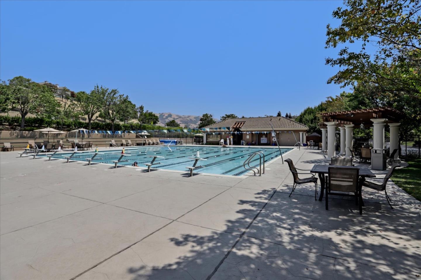 5889 Killarney Circle San Jose, CA 95138 - Photo 50 of 68 a view of a patio with table and chairs under an umbrella
