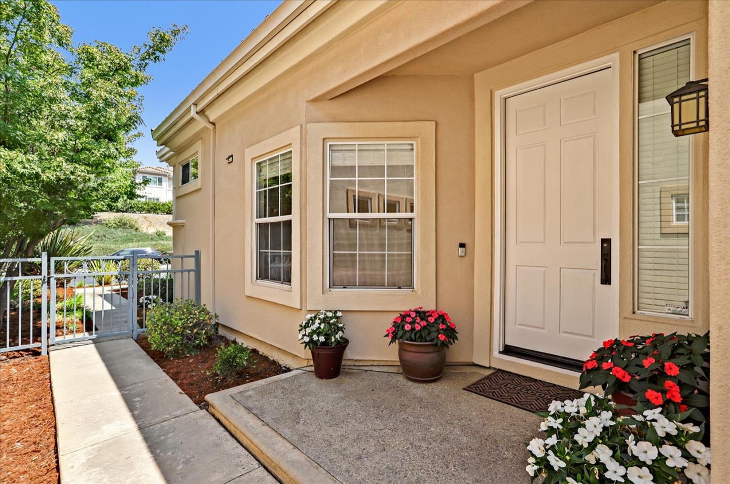 5889 Killarney Circle San Jose, CA 95138 - Photo 6 of 68 a potted plant sitting in front of a house