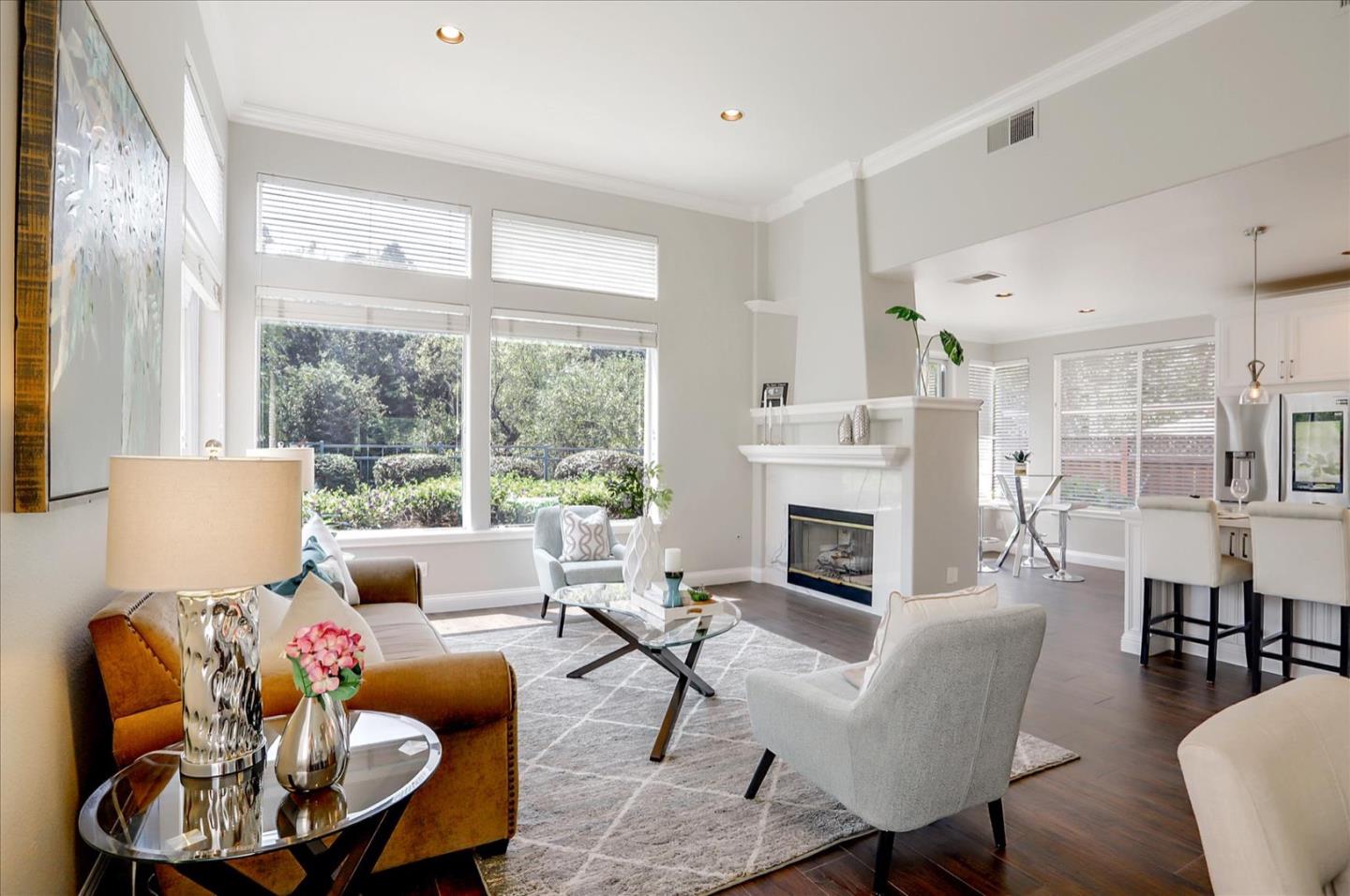 5889 Killarney Circle San Jose, CA 95138 - Photo 10 of 68 a living room with furniture a fireplace and a large window