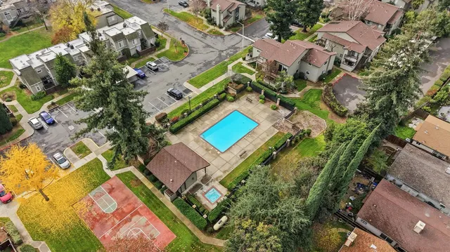 an aerial view of a house with a yard