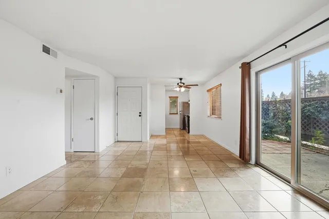 a view of a big room with windows and closet