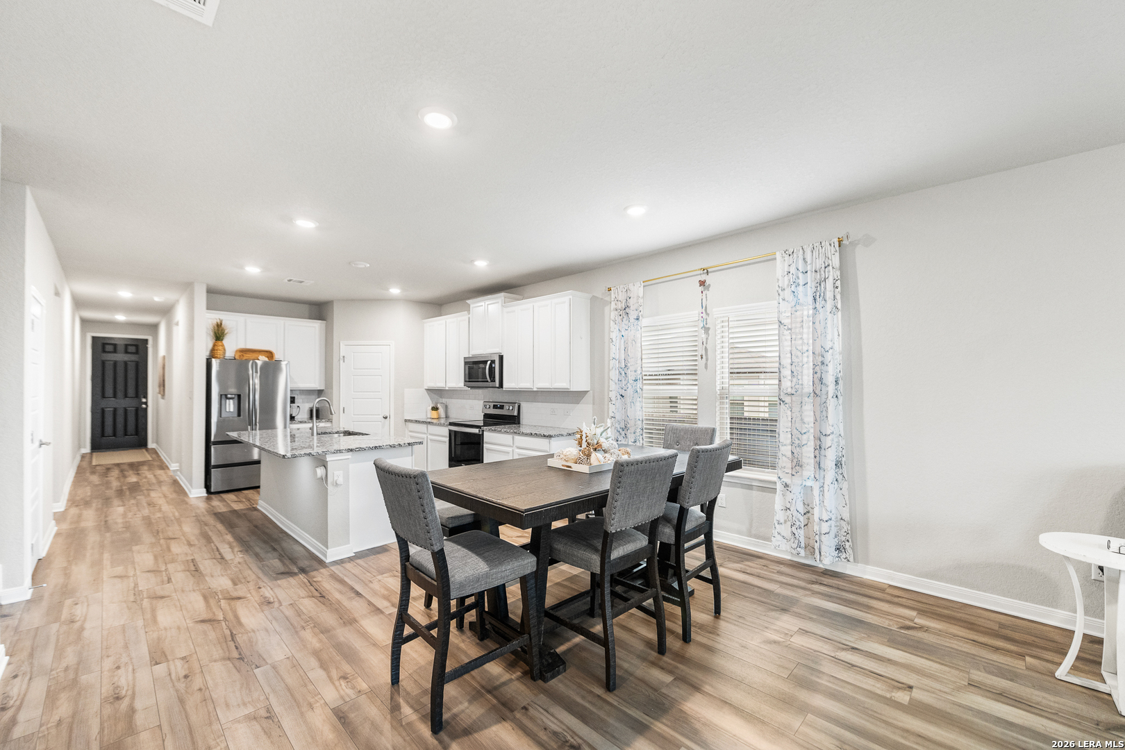 232 Colebrook Way Cibolo, TX 78108 - Photo 12 of 45 a view of a dining room with furniture and wooden floor