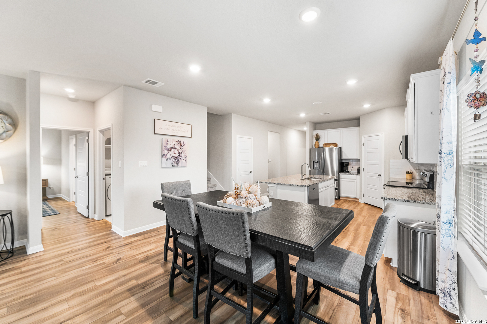 232 Colebrook Way Cibolo, TX 78108 - Photo 13 of 45 a view of a dining room with furniture and wooden floor