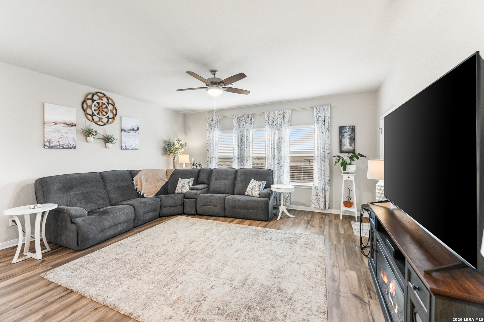 232 Colebrook Way Cibolo, TX 78108 - Photo 15 of 45 a living room with furniture and a flat screen tv