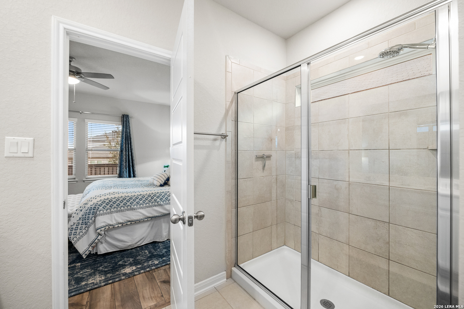 232 Colebrook Way Cibolo, TX 78108 - Photo 24 of 45 a en suite bathroom with a granite countertop tub shower and mirror