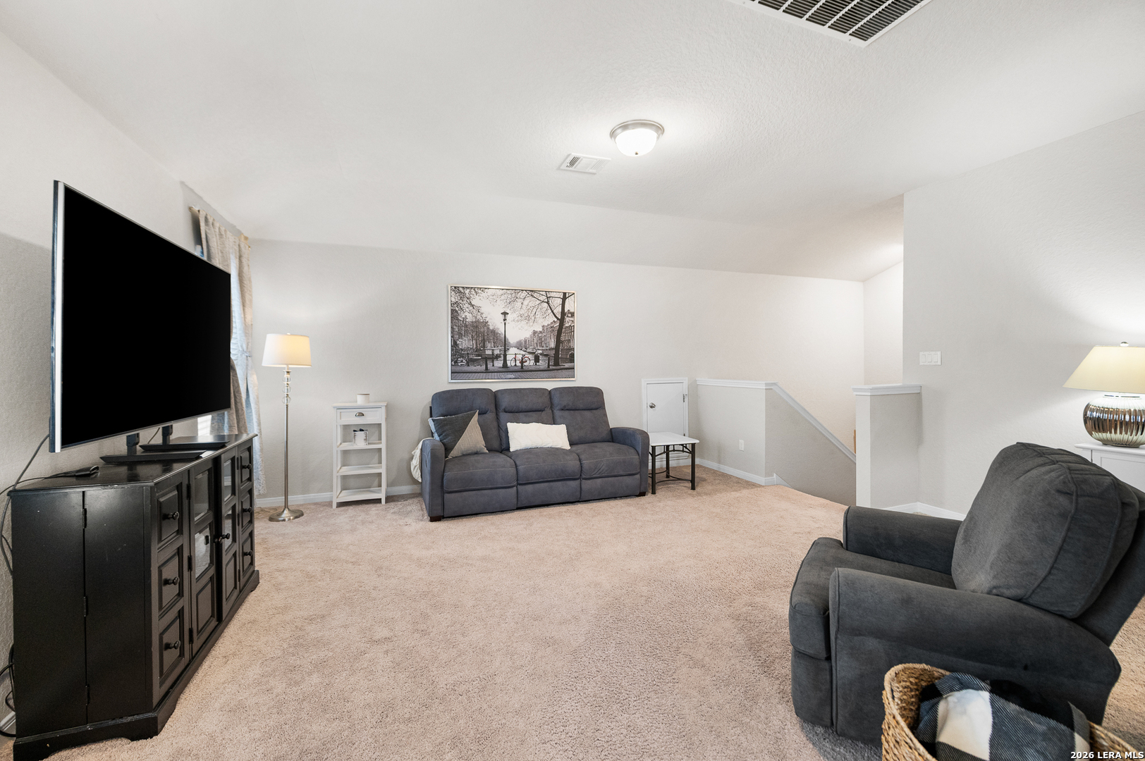 232 Colebrook Way Cibolo, TX 78108 - Photo 26 of 45 a living room with furniture and a flat screen tv