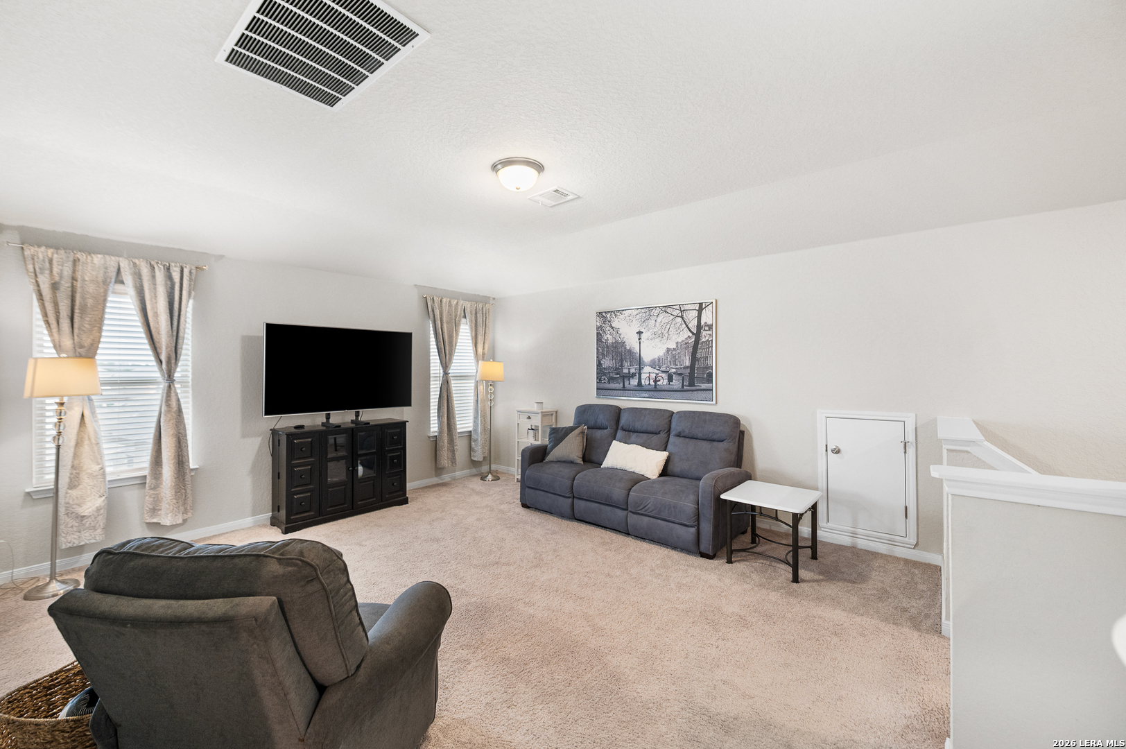 232 Colebrook Way Cibolo, TX 78108 - Photo 27 of 45 a living room with furniture and a flat screen tv