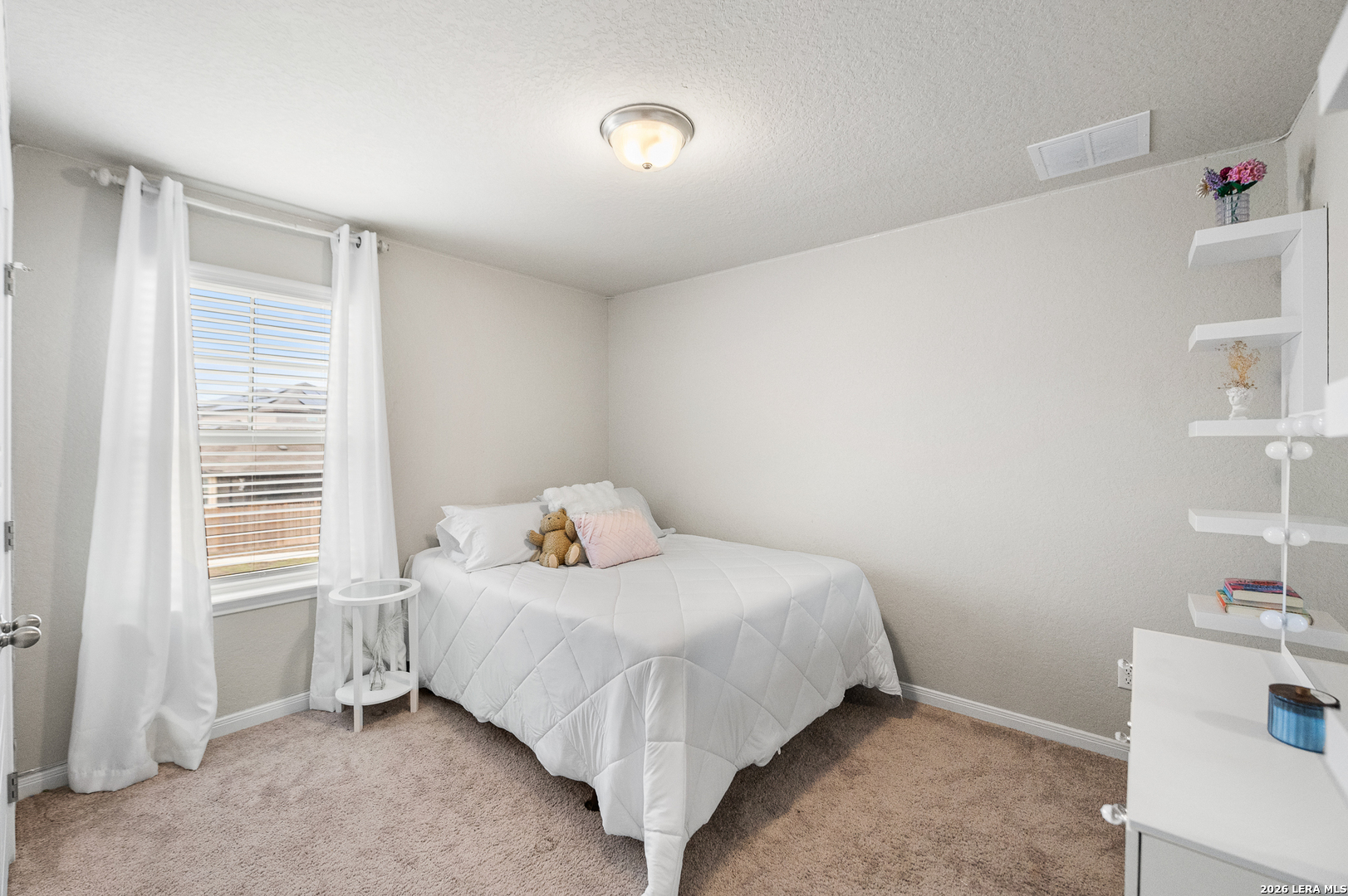 232 Colebrook Way Cibolo, TX 78108 - Photo 32 of 45 a bedroom with a bed and a window