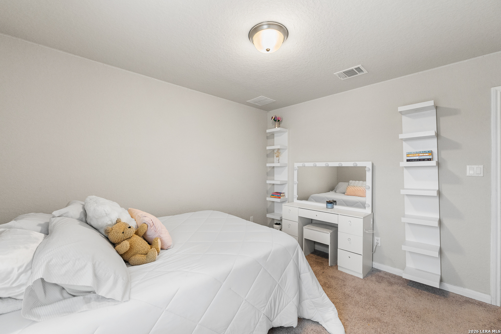 232 Colebrook Way Cibolo, TX 78108 - Photo 33 of 45 a bedroom with a bed and a fireplace