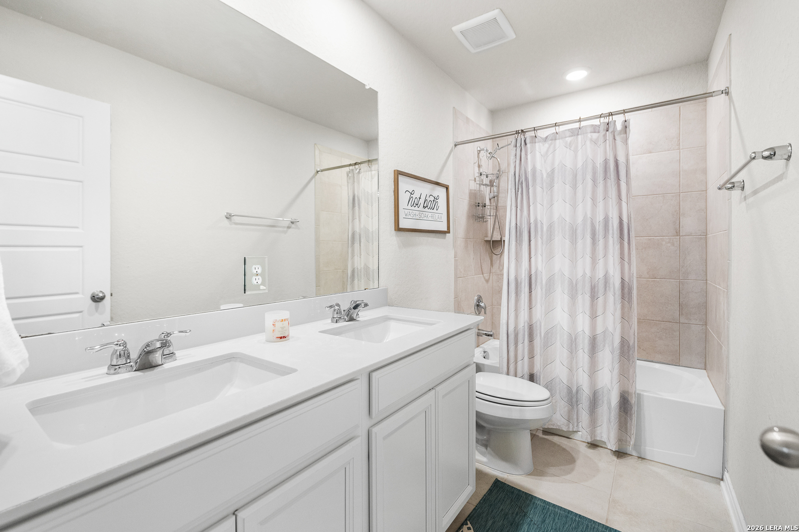 232 Colebrook Way Cibolo, TX 78108 - Photo 34 of 45 a bathroom with a sink toilet double vanity and shower