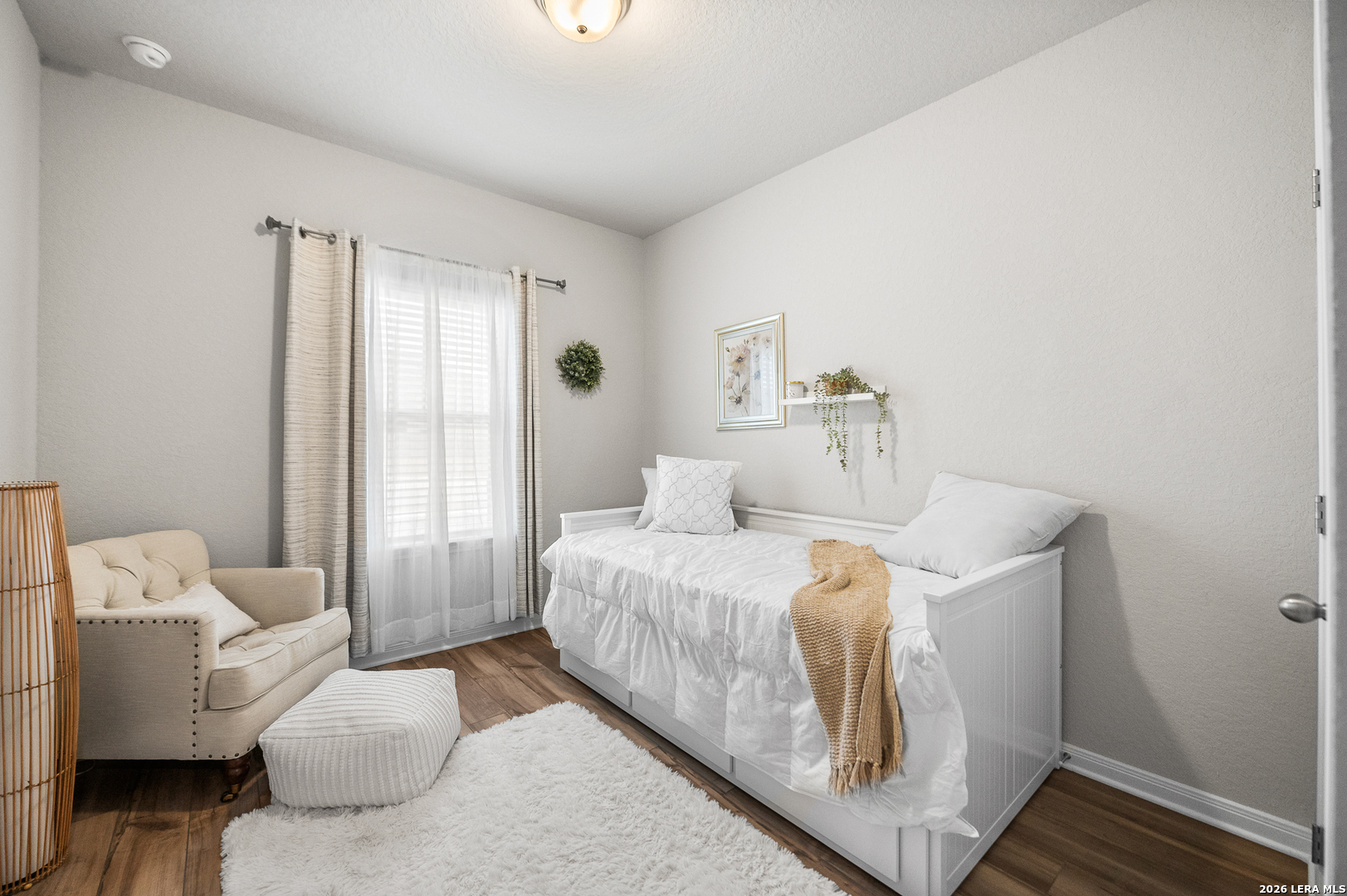 232 Colebrook Way Cibolo, TX 78108 - Photo 4 of 45 a bedroom with a bed and wooden floor