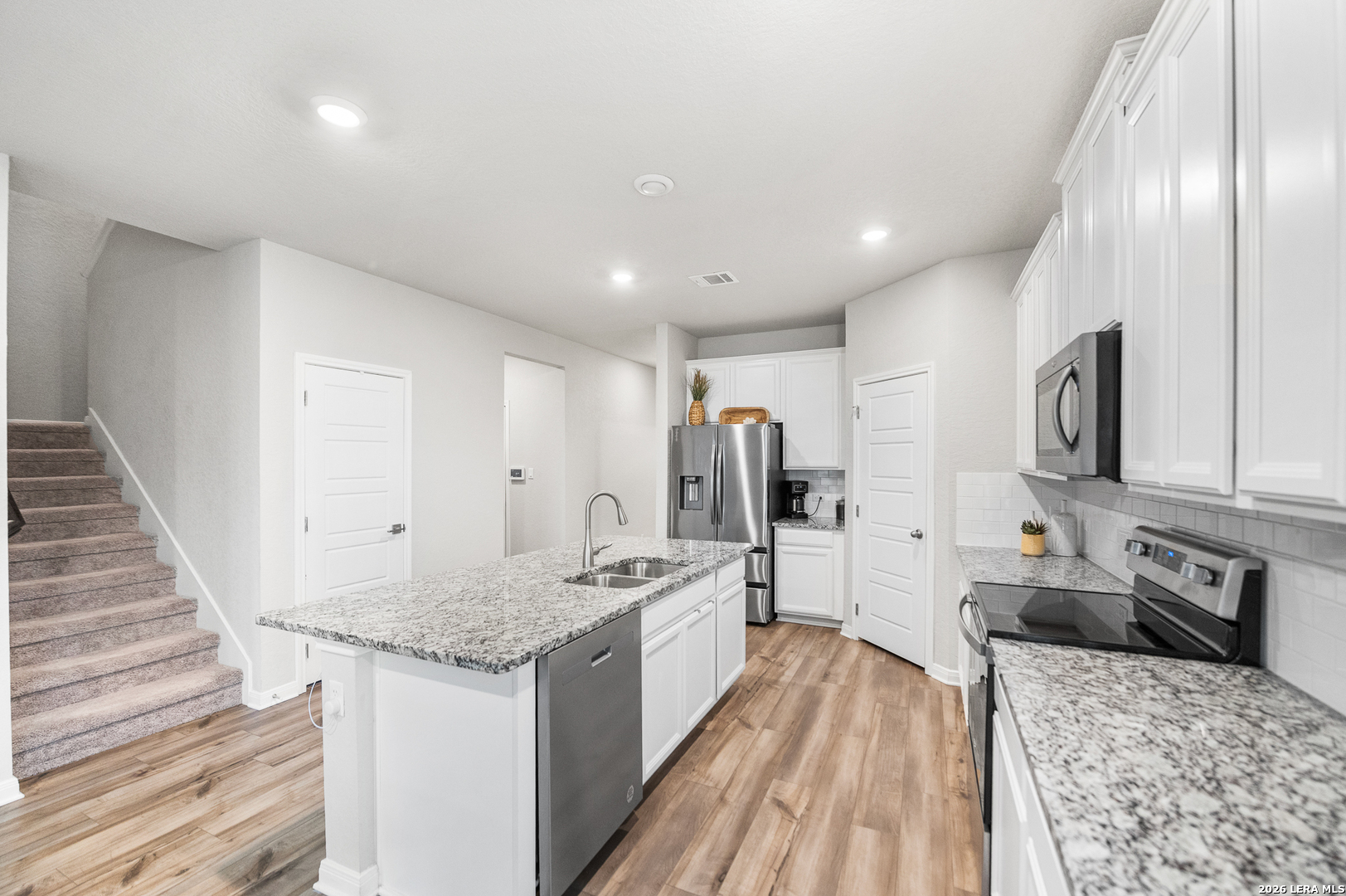 232 Colebrook Way Cibolo, TX 78108 - Photo 8 of 45 a large kitchen with stainless steel appliances granite countertop a lot of counter space and wooden floor