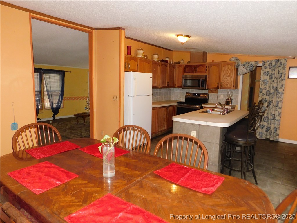 267 Ed Collins Lane Clinton, NC 28328 - Photo 14 of 45 a bedroom with furniture a bed and a chandelier