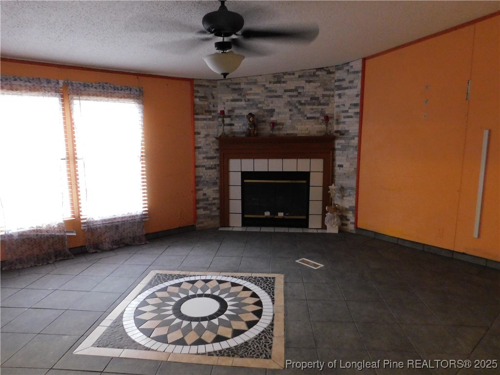 267 Ed Collins Lane Clinton, NC 28328 - Photo 19 of 45 a living room with furniture and a fireplace