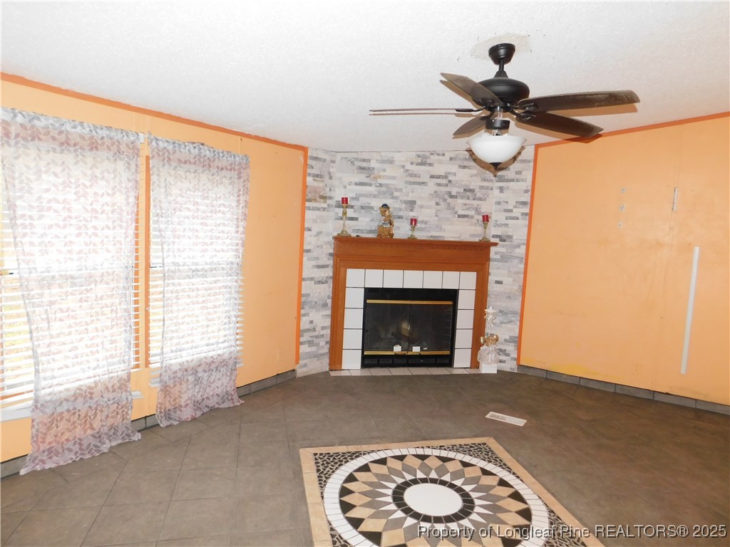 267 Ed Collins Lane Clinton, NC 28328 - Photo 20 of 45 a view of an empty room with a fireplace and a window
