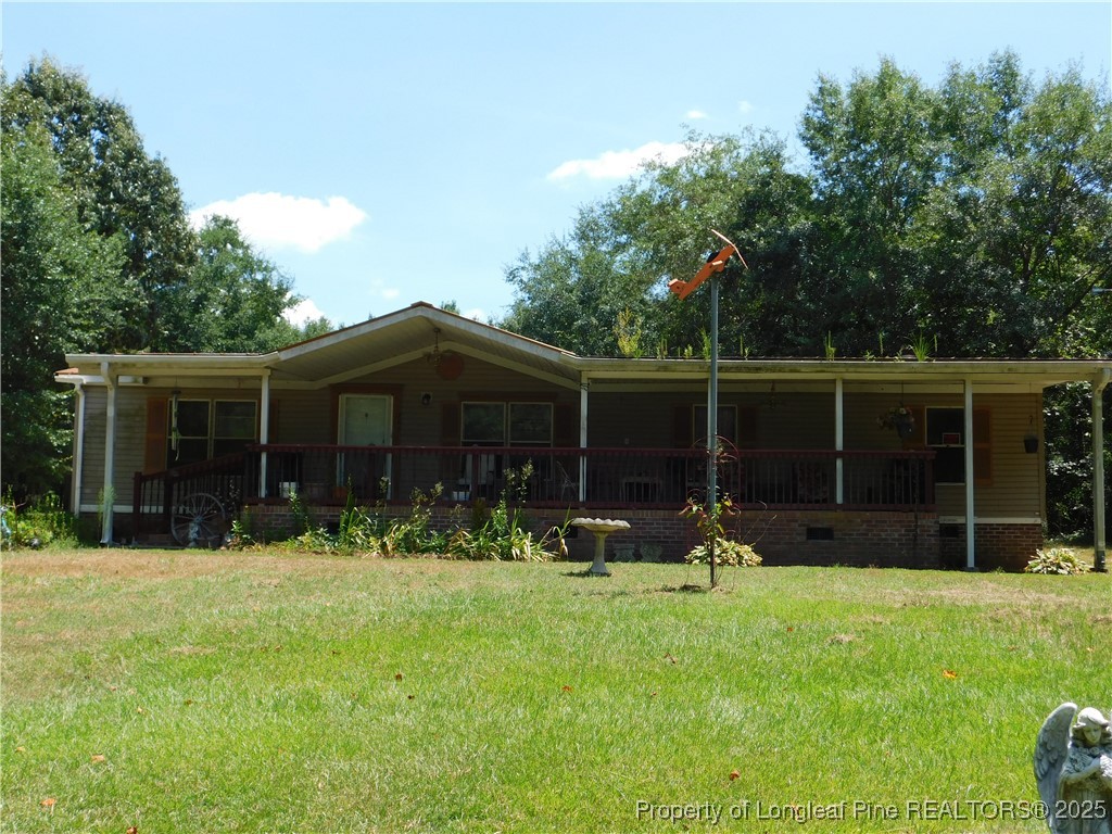267 Ed Collins Lane Clinton, NC 28328 - Photo 2 of 45 a front view of house with yard and green space