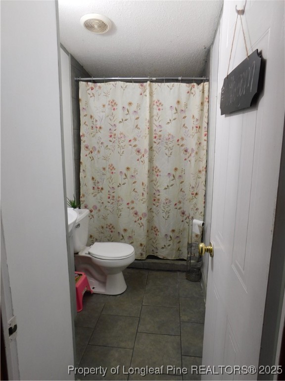 267 Ed Collins Lane Clinton, NC 28328 - Photo 22 of 45 a bathroom with a toilet and a shower