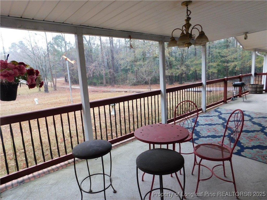 267 Ed Collins Lane Clinton, NC 28328 - Photo 9 of 45 a view of a chairs in balcony