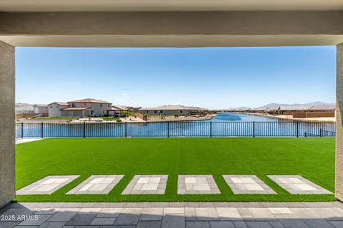 a view of a yard with a table and chairs