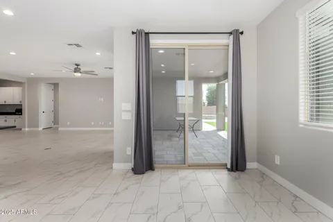 wooden floor and a bathroom with a glass door shower