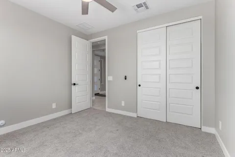 an empty room with closet area
