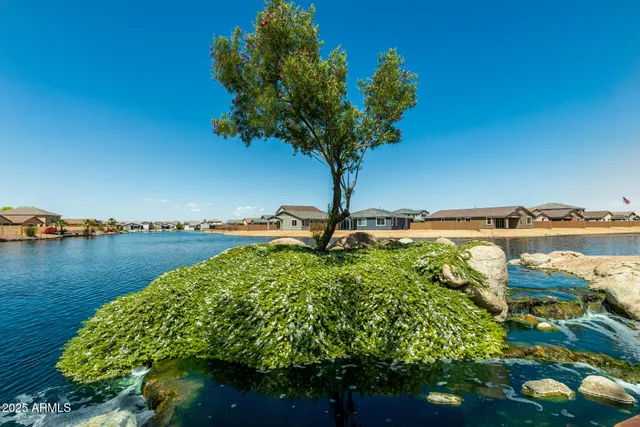 a lake view with a building in the background