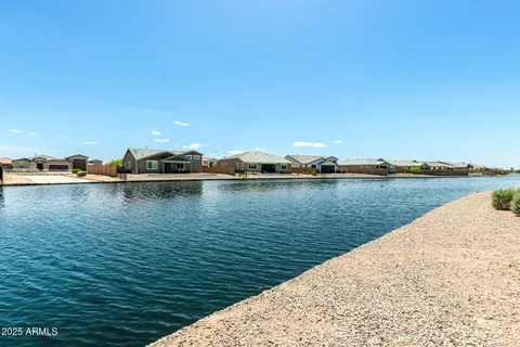 a view of a lake with a yard