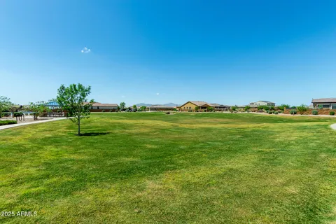 a view of a field with an ocean