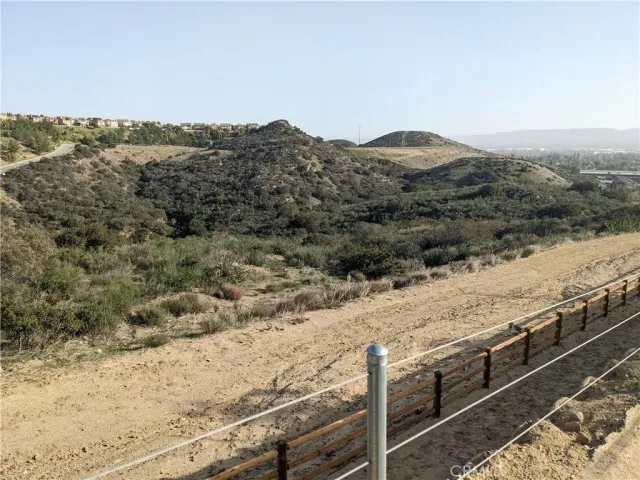 a view of a dry yard with mountain