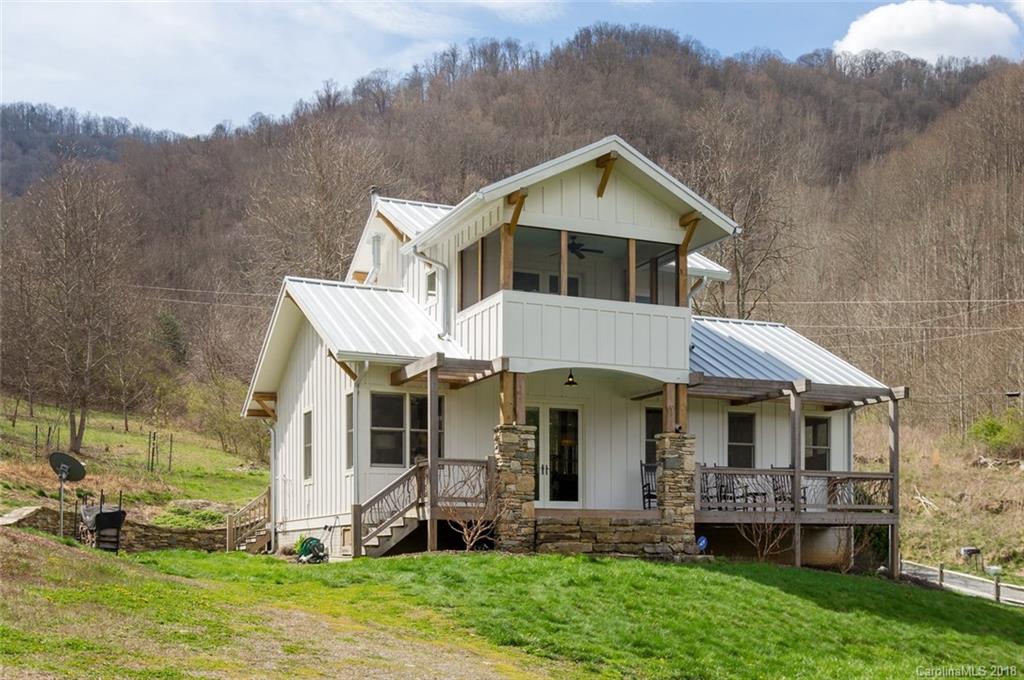 835 Secluded Valley Road Marshall, NC 28753 - Photo 1 of 21 a front view of a house with a yard and porch