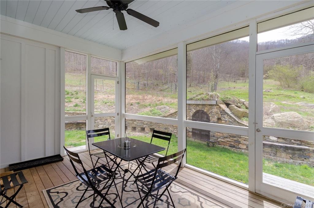 835 Secluded Valley Road Marshall, NC 28753 - Photo 11 of 21 a view of a dining room with furniture window and outside view