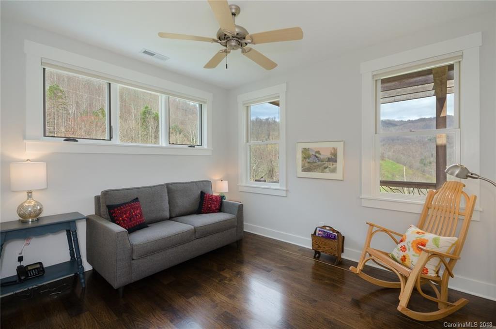 835 Secluded Valley Road Marshall, NC 28753 - Photo 12 of 21 a living room with furniture and a window