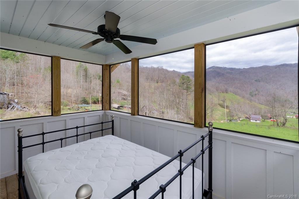 835 Secluded Valley Road Marshall, NC 28753 - Photo 17 of 21 a view of room with furniture and a large window