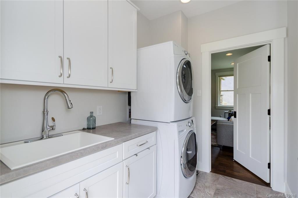 835 Secluded Valley Road Marshall, NC 28753 - Photo 18 of 21 a utility room with sink dryer and washer
