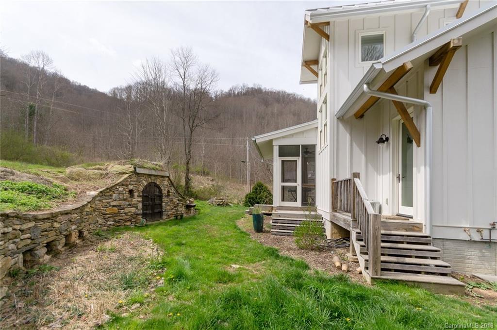 835 Secluded Valley Road Marshall, NC 28753 - Photo 19 of 21 a view of a house with backyard and sitting area