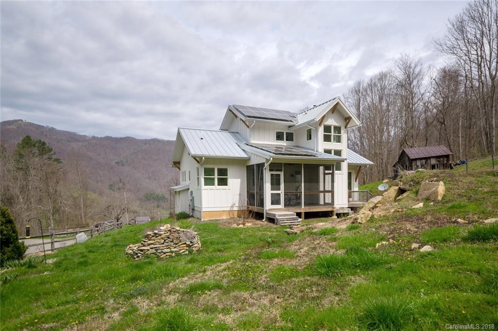 835 Secluded Valley Road Marshall, NC 28753 - Photo 21 of 21 a front view of a house with a garden and yard