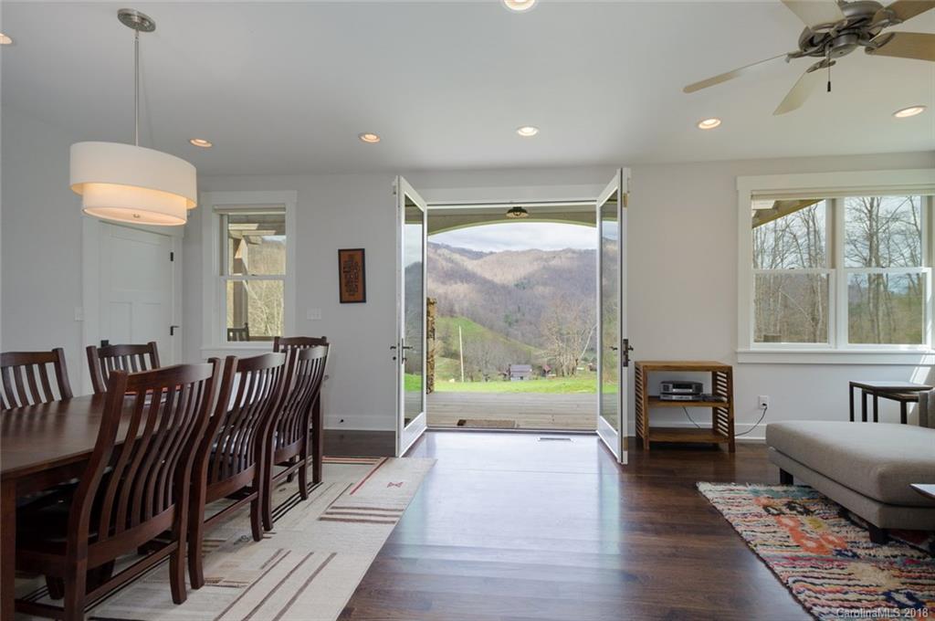 835 Secluded Valley Road Marshall, NC 28753 - Photo 5 of 21 a living room with furniture and a floor to ceiling window