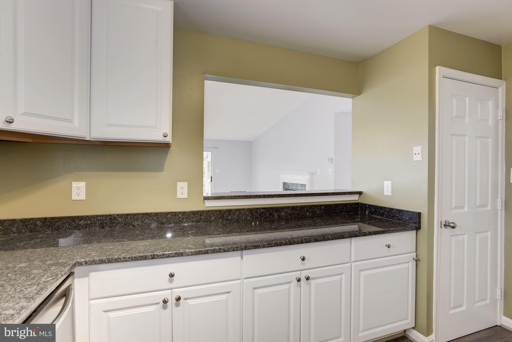 20579 Snowshoe Square, Unit 301 Ashburn, VA 20147 - Photo 12 of 30 a sink sitting inside of a granite counter top