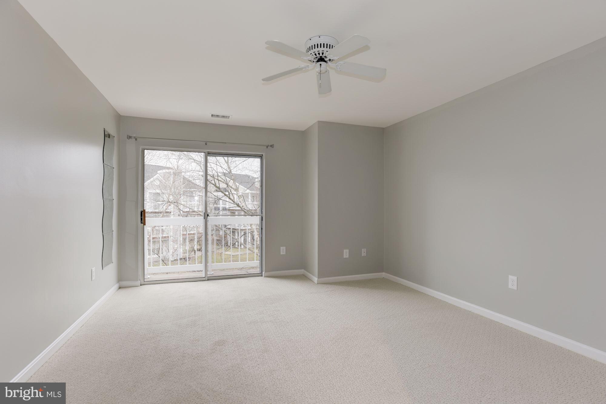 20579 Snowshoe Square, Unit 301 Ashburn, VA 20147 - Photo 15 of 30 wooden floor in an empty room with a window