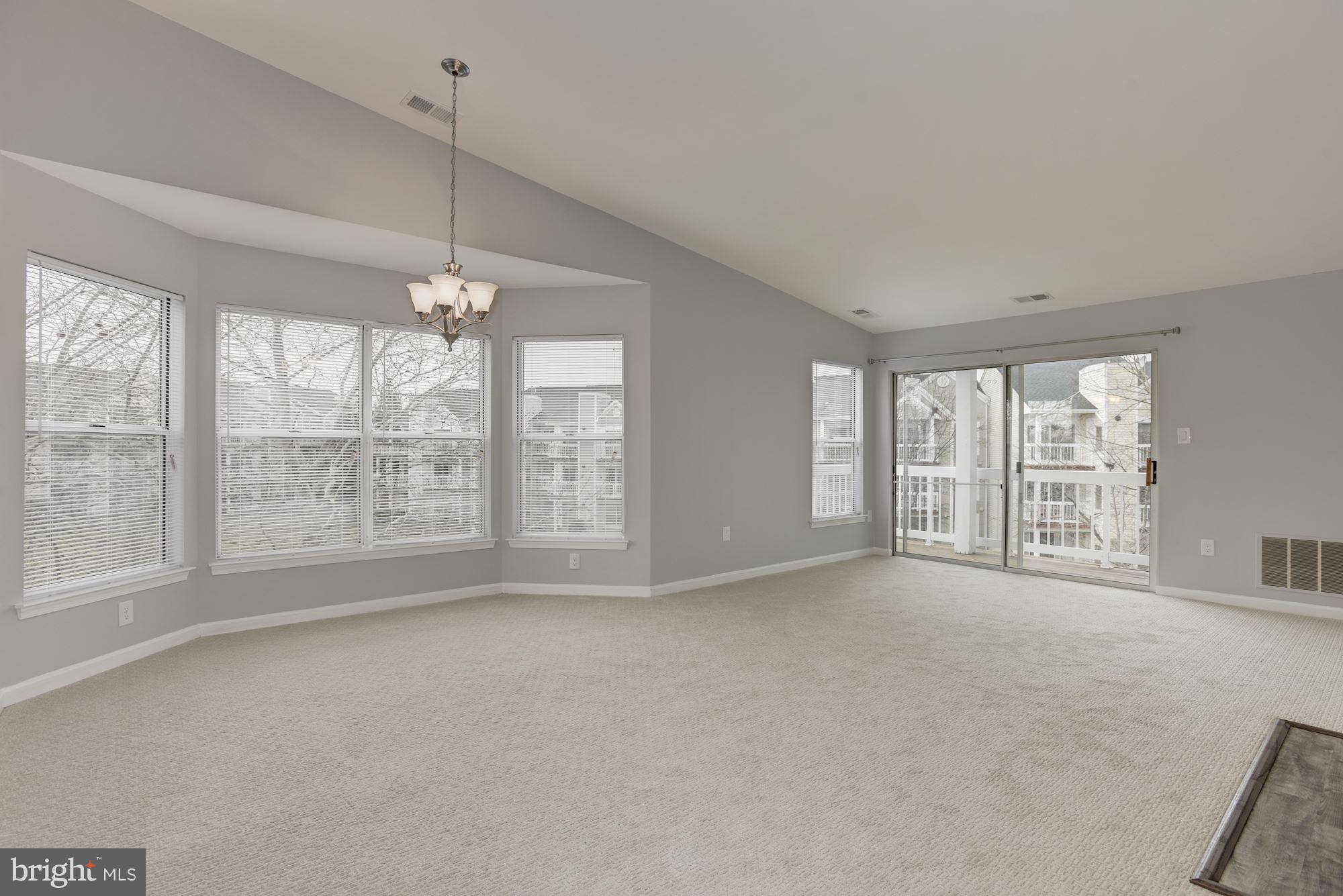 20579 Snowshoe Square, Unit 301 Ashburn, VA 20147 - Photo 3 of 30 a view of an empty room with a window